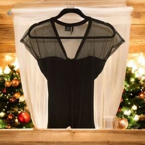 Formal black sheer sparkly top size Al cap sleeves fun design in front …